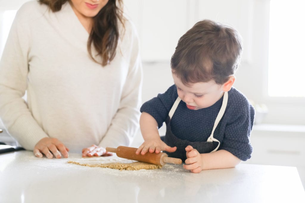 Kid rolling the dough ball