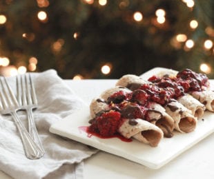 Sprouted oat crepes with raspberries and chocolate sauce