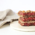 Raspberry orange oat bars stacked on each other